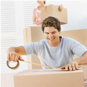 a man taping a box