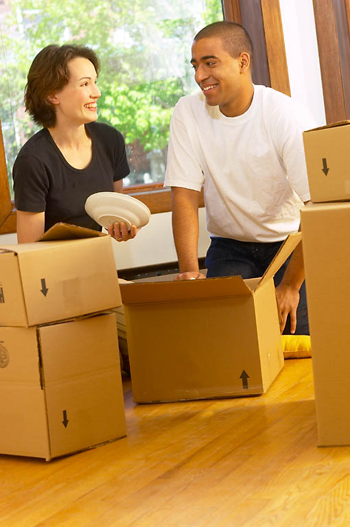 a couple unpacking their belongings